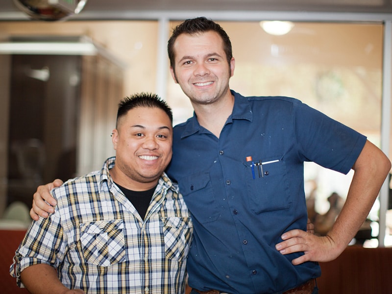 Two people smiling at Mckinley Park