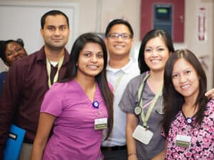 A group of employees smiling at Mckinley Park