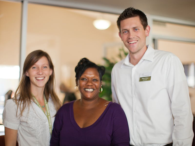 Three employees smiling at Mckinley Park